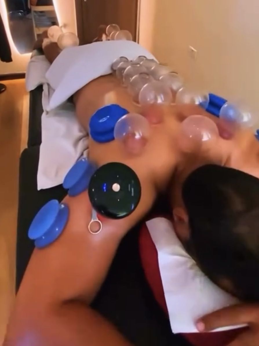 Blue silicone and glass cups across the back and arm